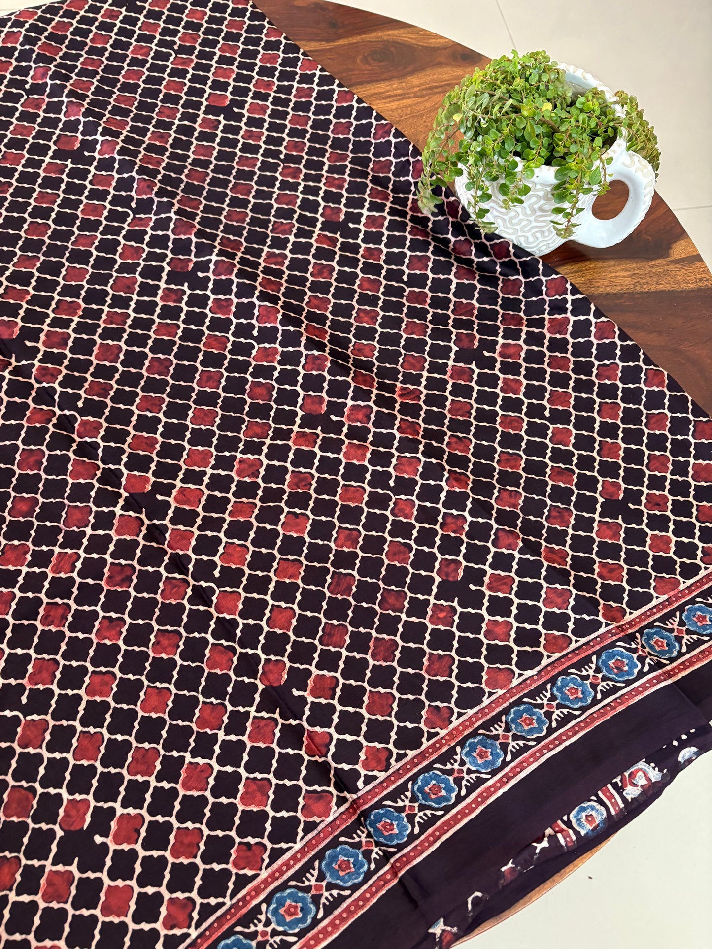 Black plain Modal silk saree with block printed pallu and blouse