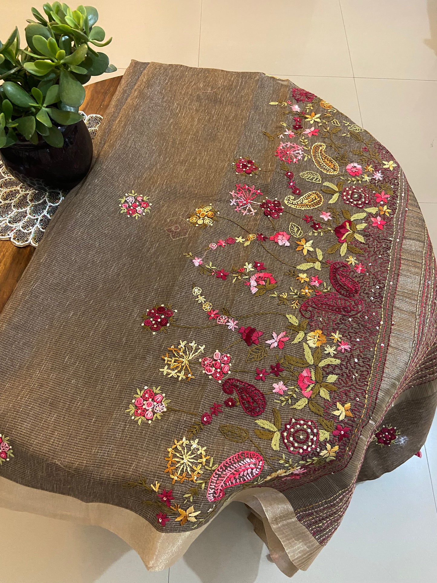 Hand Embroidery on linen tissue silk saree