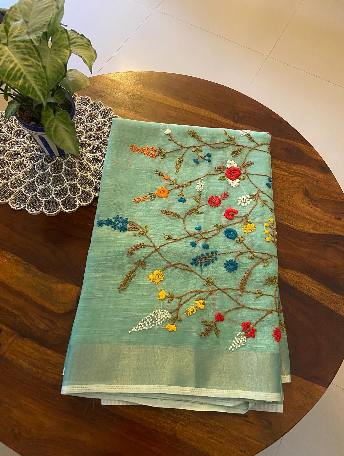 Hand Embroidery on Linen tissue silk saree