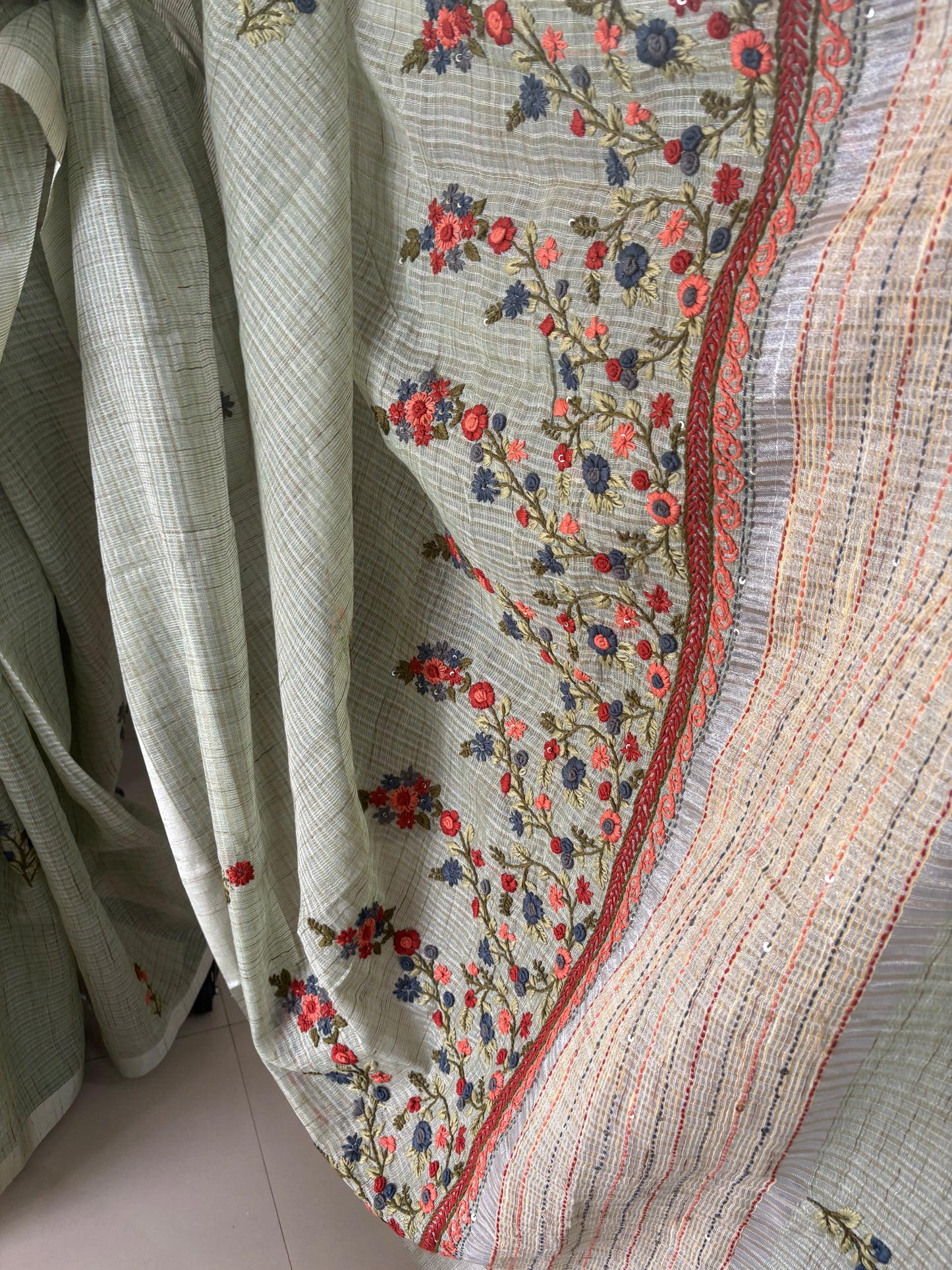 Hand embroidery on Kota tissue silk saree