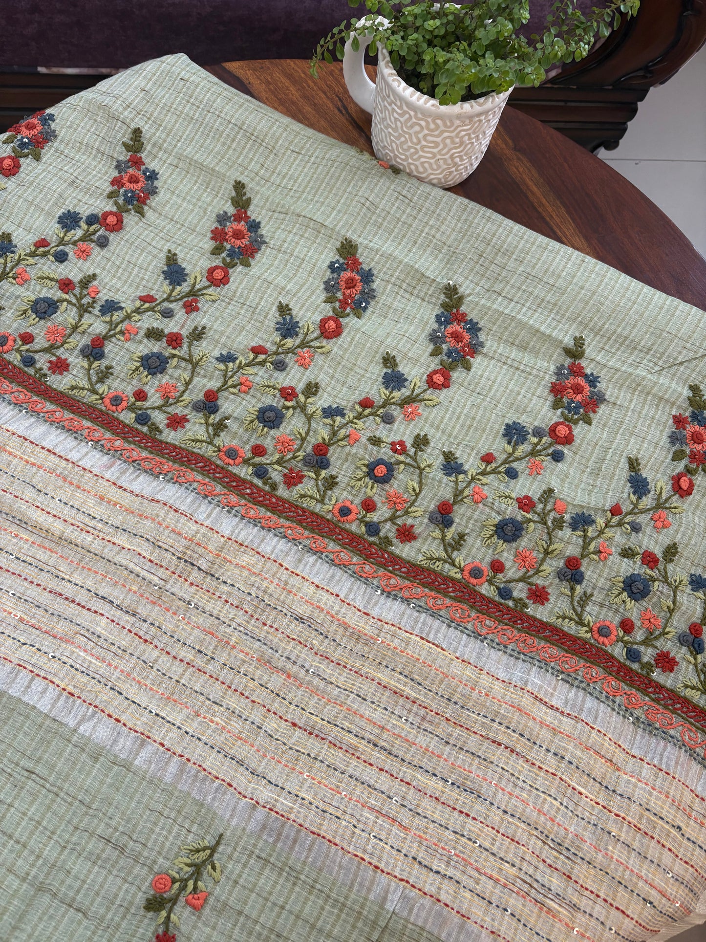 Hand embroidery on Kota tissue silk saree