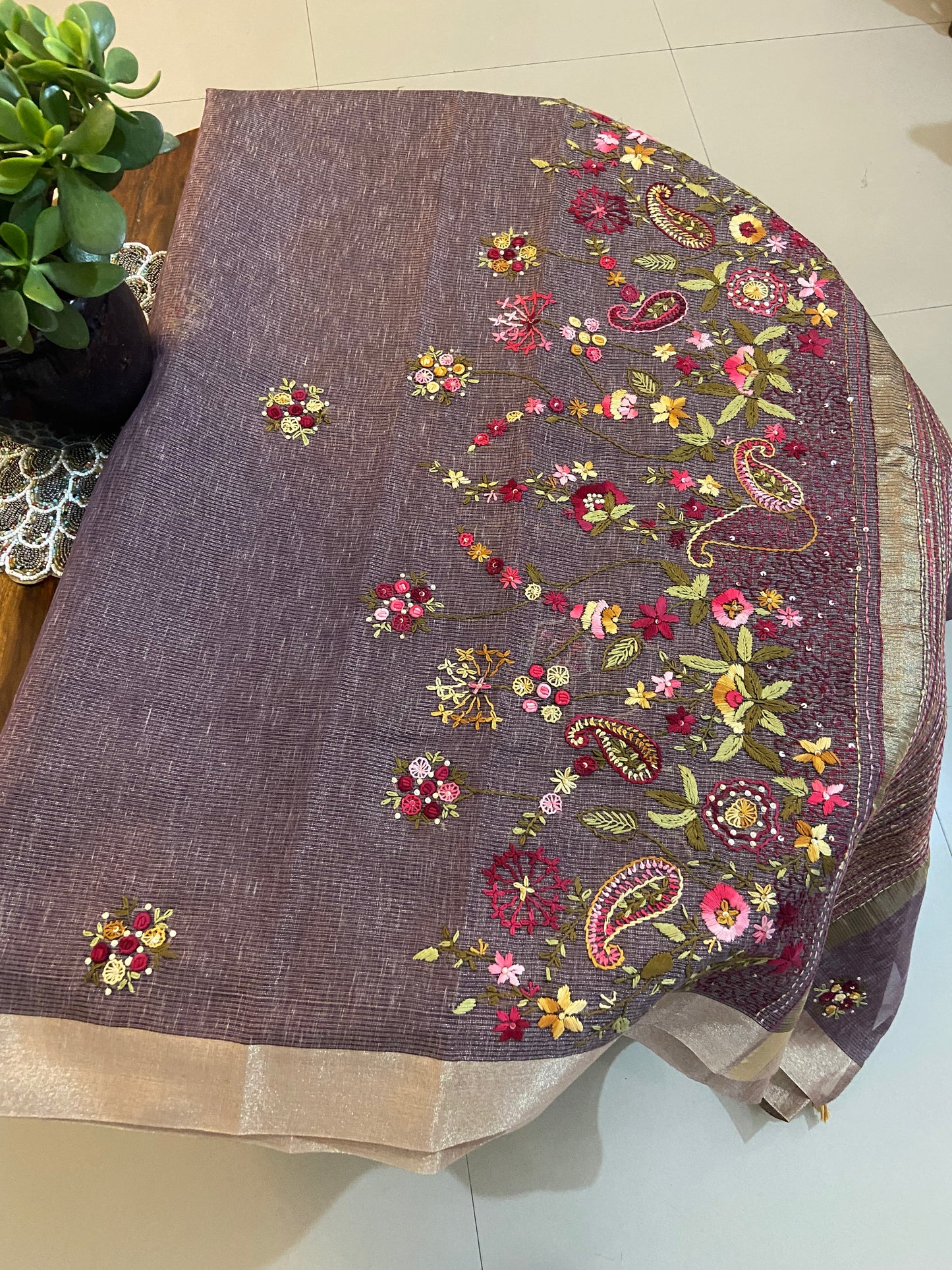 Hand embroidery on linen tissue silk saree